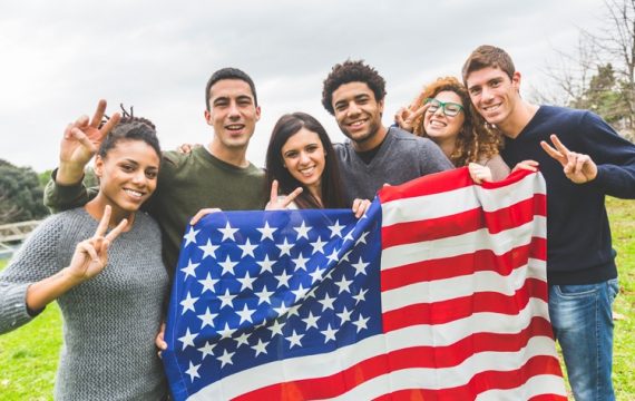 american-students-posing-with-usa-stars-and-stripes-flag